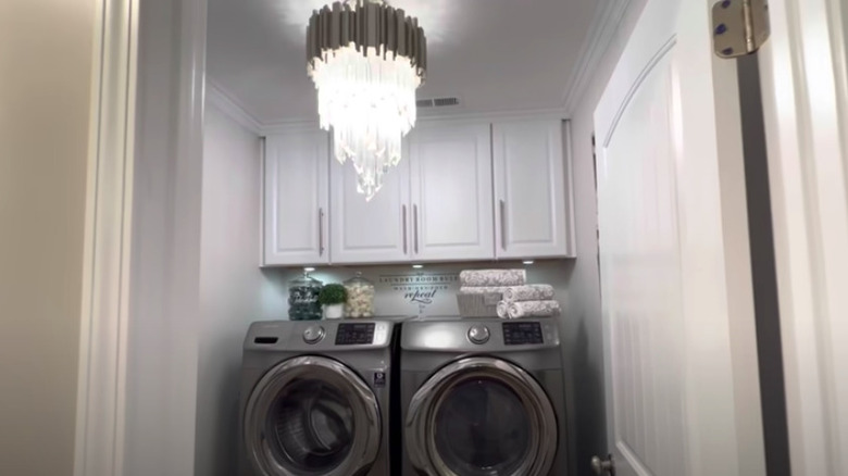 Luxury laundry room with chandelier