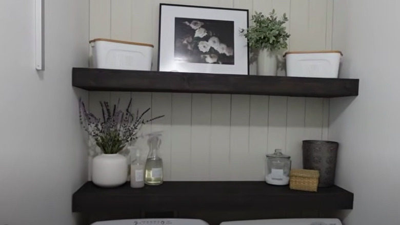 Laundry room with black shelves