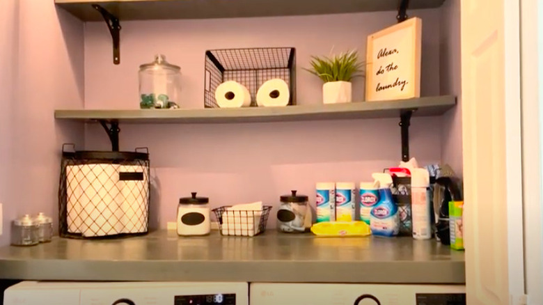 Purple laundry room with shelves