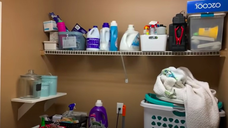 Dark, cluttered laundry room