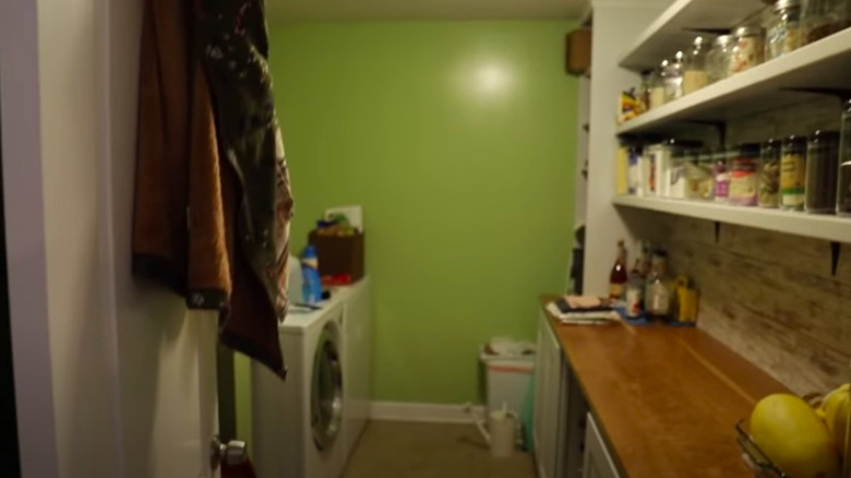 Green and cluttered laundry room