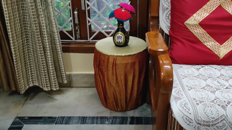 bucket side table beside chair