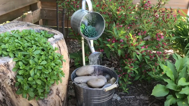 bucket watering can water feature