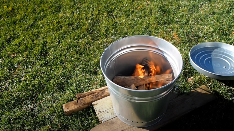 bucket with burning wood