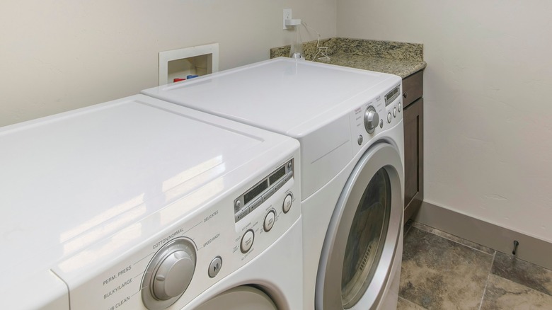 cabinet between washer and wall