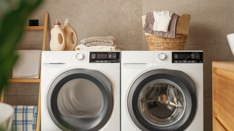 detergent and towels on washer