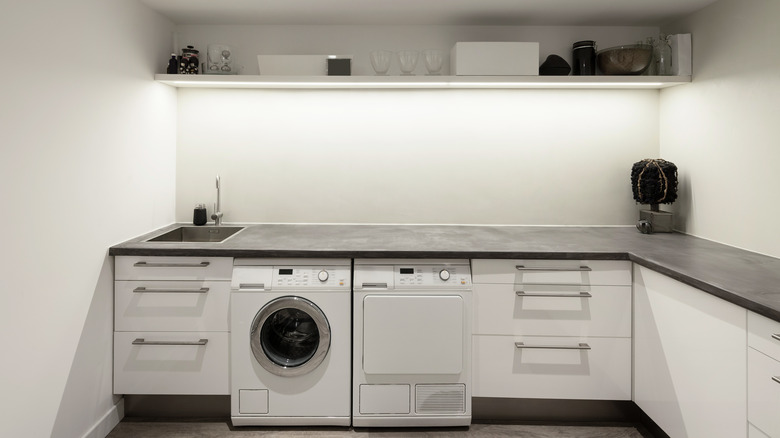 tall shelf above washing machine