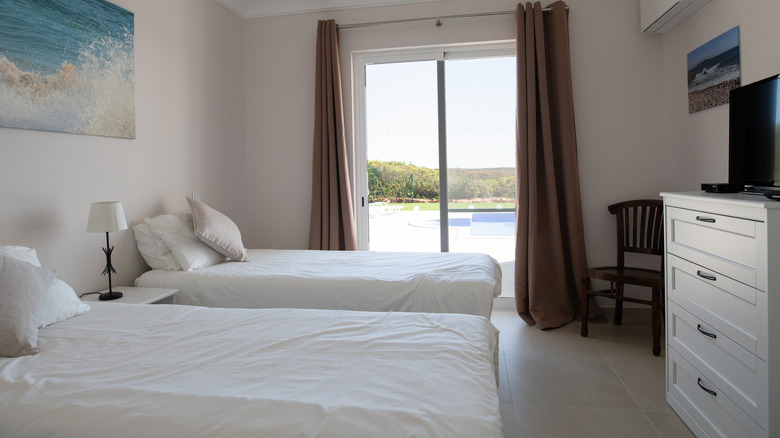 white room with two beds