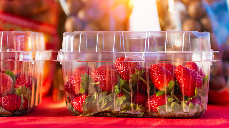 Strawberries in plastic berry containers