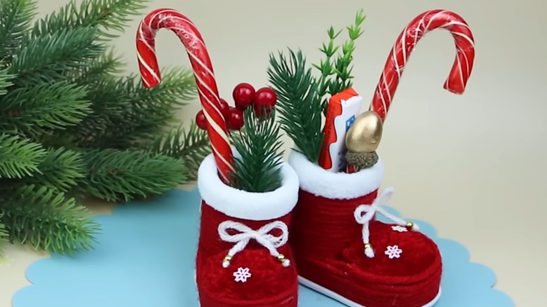 DIY Santa boots stuffed with candy and evergreen sprigs