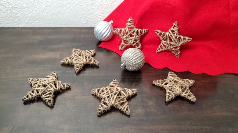 Stars made from twine and disco balls on a table