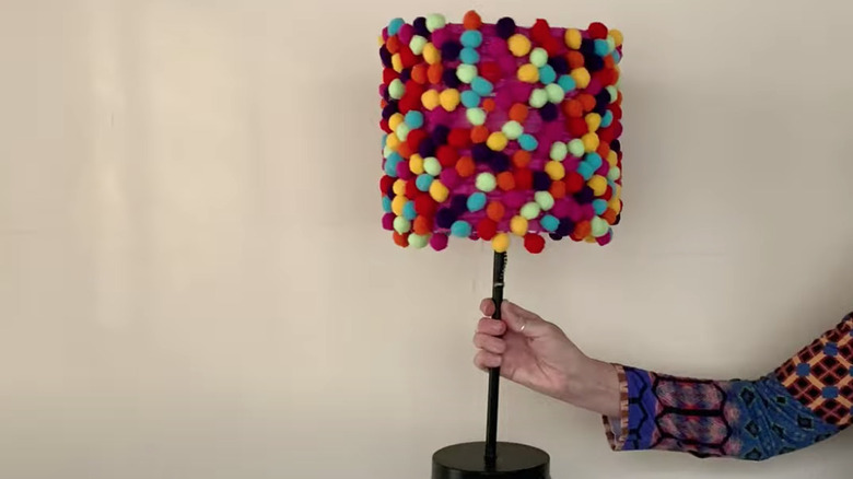 lampshade covered in pom poms