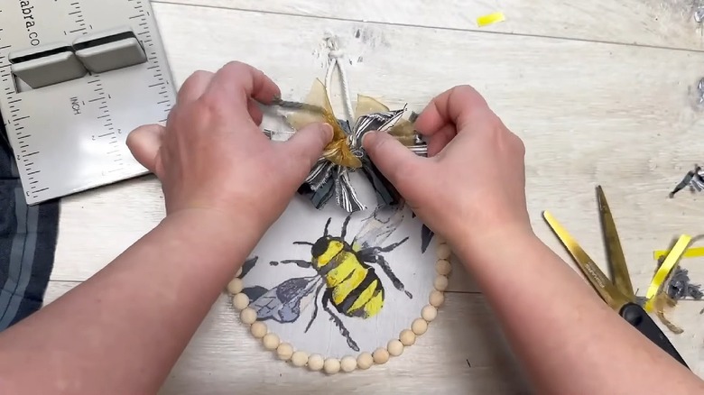 Embroidery hoop decor with bee print scarf.