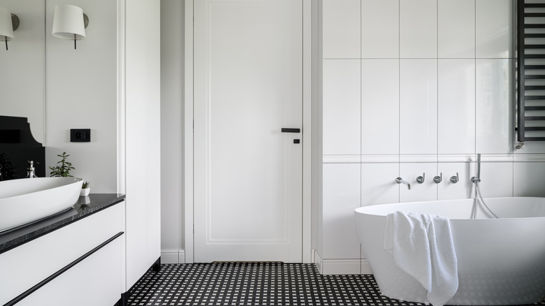 white bathroom with black floor