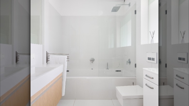 white bathroom with wooden vanity