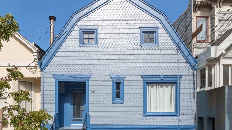 blue house with decorative exterior