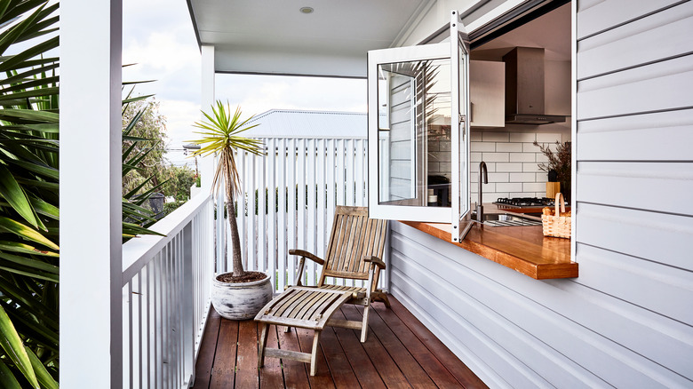 white balcony with lounging chair