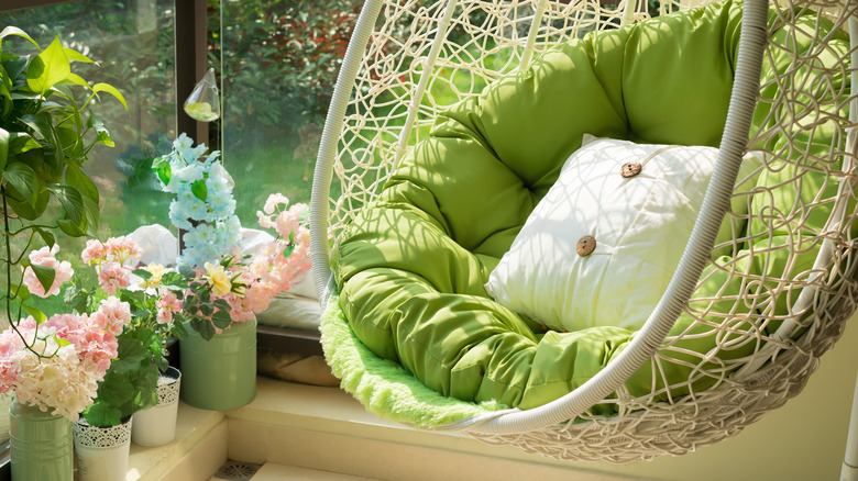 green hanging chair on balcony