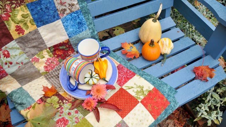 A quilt on a bench