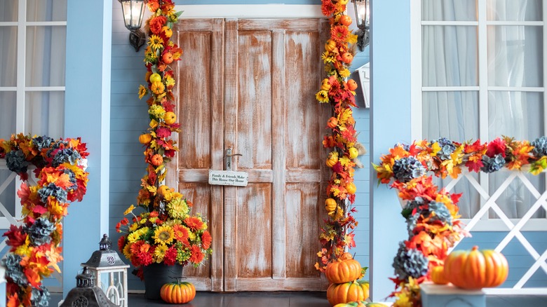 Wooden door with fall garlands