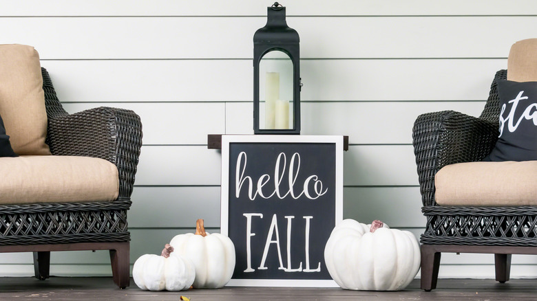 White pumpkins with fall sign