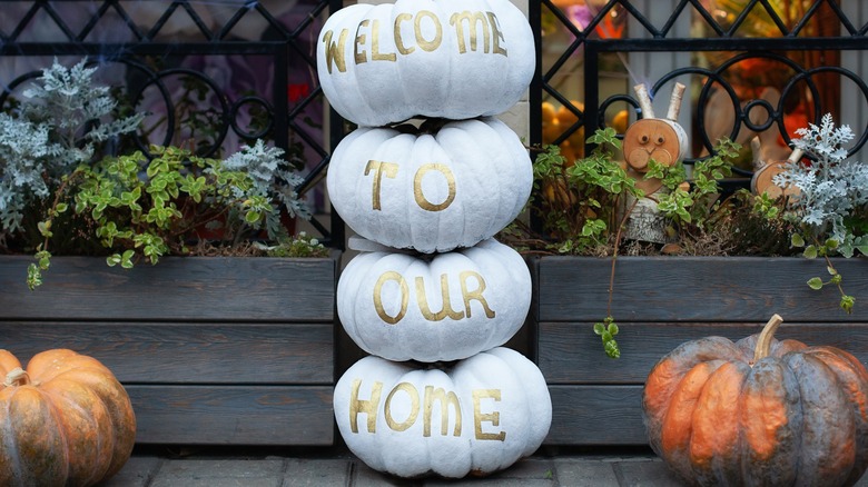 Stacked and painted pumpkins