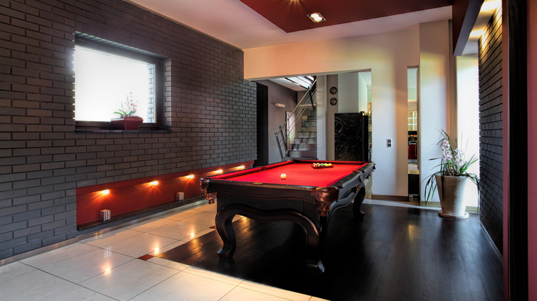 basement with red pool table