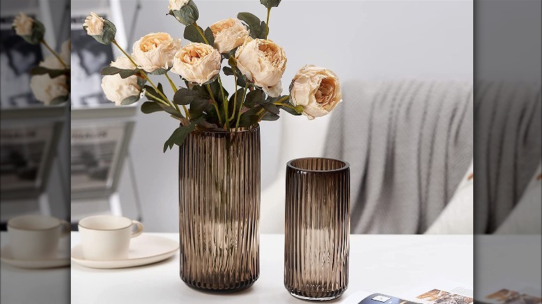 Two ribbed vases with roses