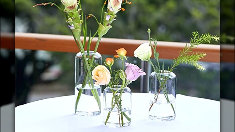 Glass bud vases with flowers