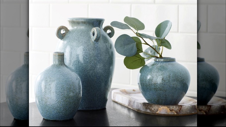 Three blue ceramic vases