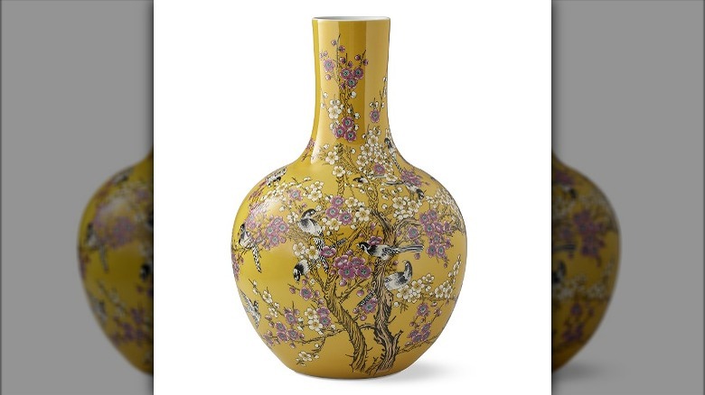 Yellow vase with flower scene