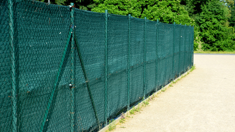 Green fabric and chain link fabric fence