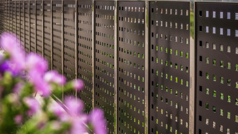 brown perforated metal fence