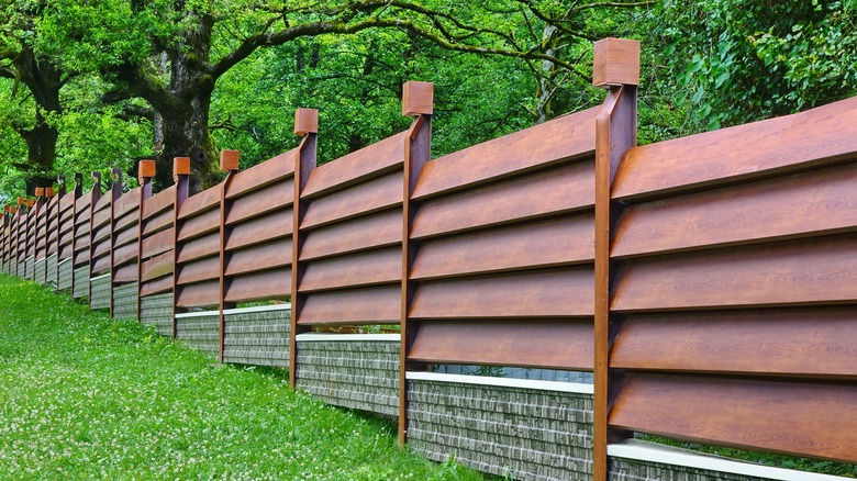 Faux wood metal fence