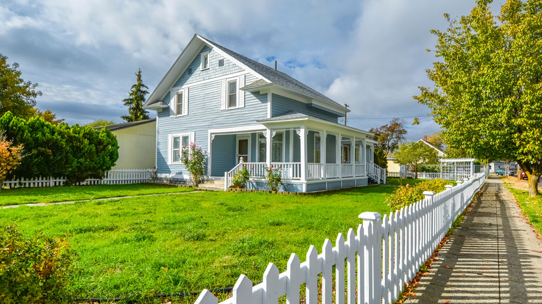 white picket fence along house