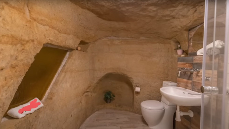 bathroom built inside rock