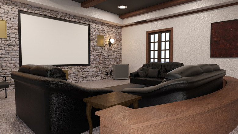 home theater with brick wall