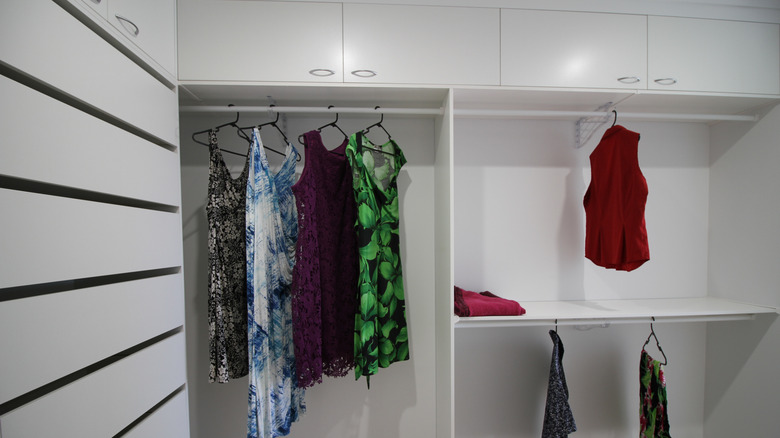 white closet with few clothes