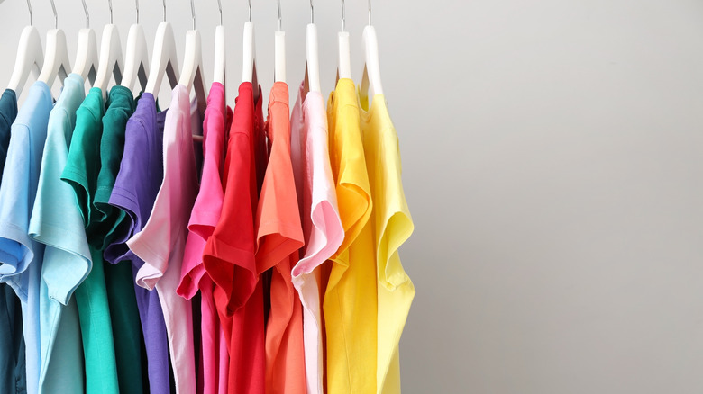 hanging shirts organized by color