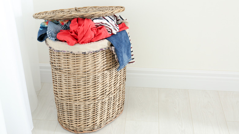 hamper overflowing with clothes