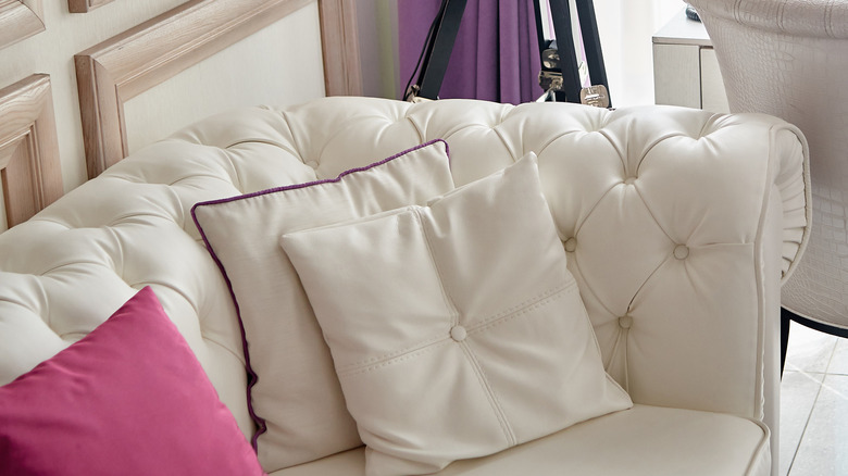 white tufted velvet sofa