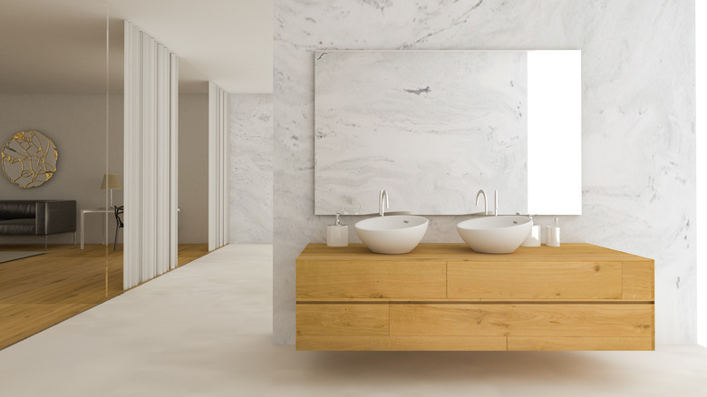 Marble bathroom with wood counter