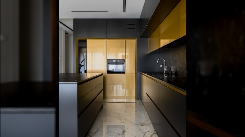 Black kitchen cabinets marble floor