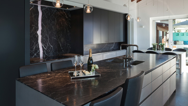 Black marble and kitchen cabinets