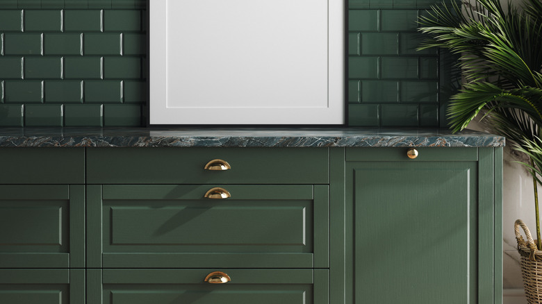 Dark green kitchen and marble