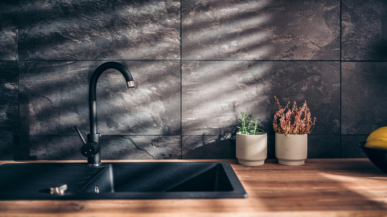 Matte black marble backsplash