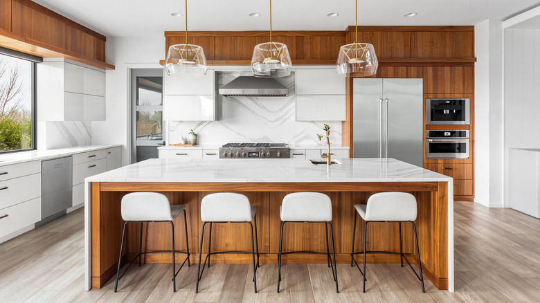 Dark kitchen cabinets marble walls