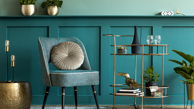 teal wall with chair