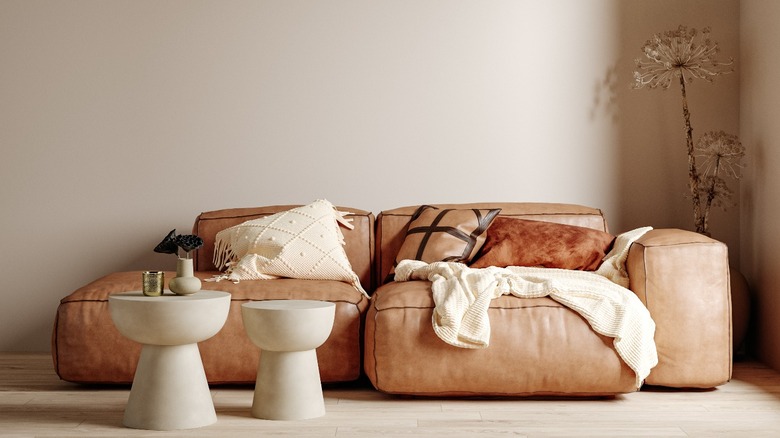 Sectional sofa on beige wall