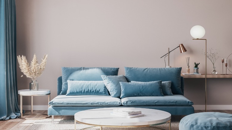 Greige living room with blue sofa